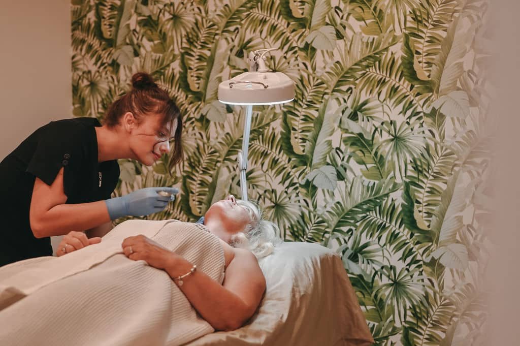 Laura sugaring a client in the studio
